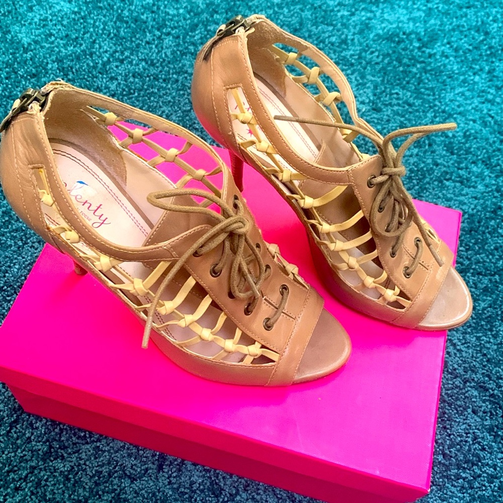 Women dress heels. Genuine leather upper. Tie up. Fishnet style on sides.